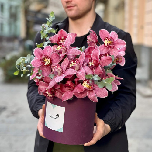 Crimson composition of cymbidiums and eucalyptus «Tropical butterfly»