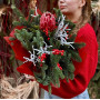 Winter bouquet of pine branches with protea «Winter Star»
