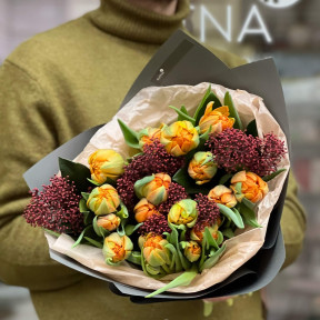 Bright bouquet with fragrant skimmia and orange peony tulips «Cozy dawns»
