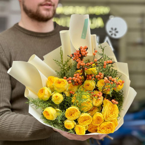 Bright yellow bouquet of spray peony roses and ilex «Sunny berries»