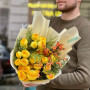 Bright yellow bouquet of spray peony roses and ilex «Sunny berries»
