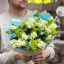 Spring bouquet of variegated tulips, viburnum and oxypetalum «Green wave»