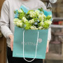 Spring bouquet of variegated tulips, viburnum and oxypetalum «Green wave»