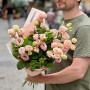 7 eustoma branches of Lisadora Apricot variety with raspberry sprigs in a bouquet «Peach-Mint»