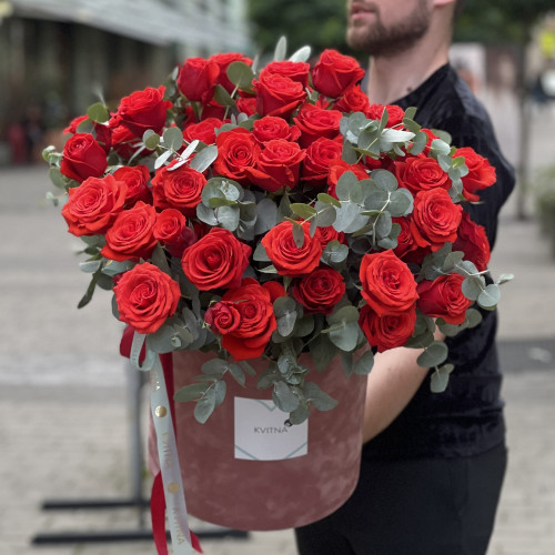 65 bright red Nina roses in the composition «Flame of Love»