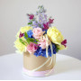Composition with flowers in a hat box