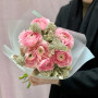 Delicate pink bouquet of 7 ranunculi and skimmia