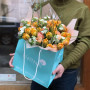 Spring bouquet of ranunculus, peony tulips and oxypetalum «Orange Sky»